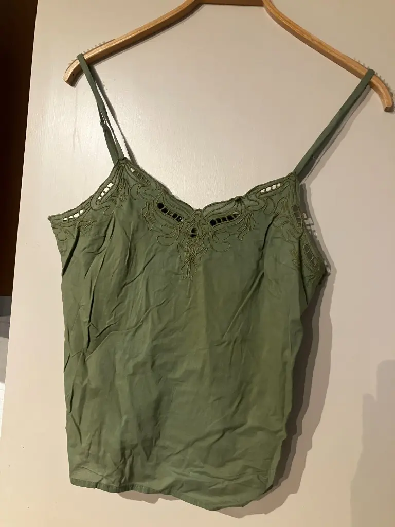 Raw flat lay clothing photo before AI — casual overhead shot for ecommerce