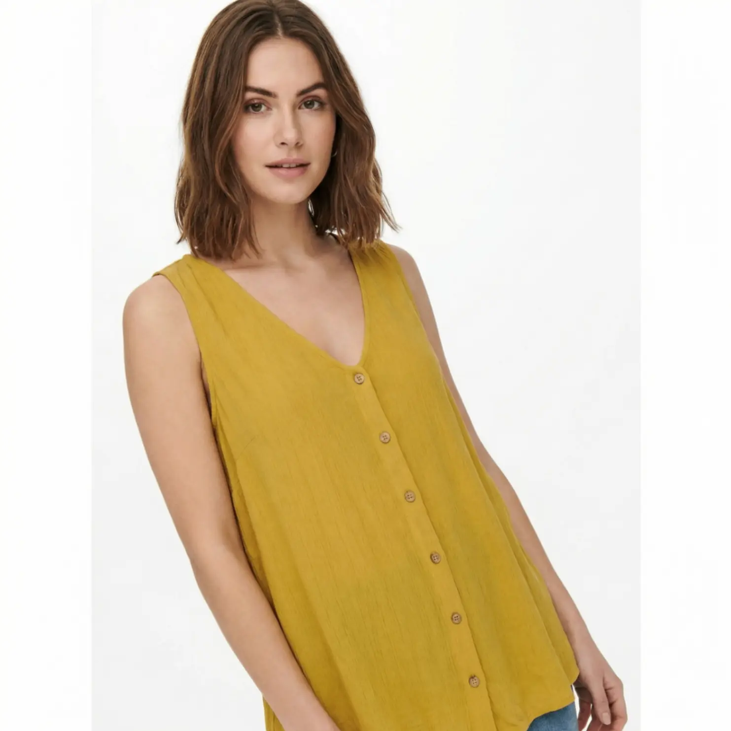 Yellow sleeveless button top on female model